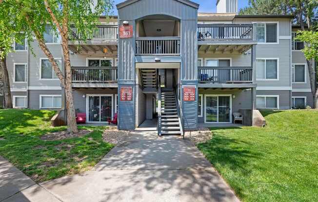 Apartment building with a red sign on the door.