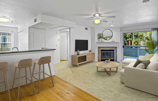 Carpeted Living Room with Fireplace and Balcony