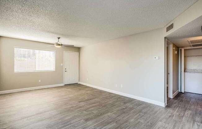 A room with a ceiling fan and a window with blinds at Sterling Point Apartment Homes, Phoenix