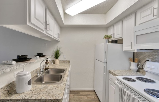 This is a photo of the kitchen in the 477 square foot 1 bedroom apartment at Canyon Creek Apartments in Dallas, TX.