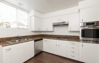 Kitchen with Stainless Steel Appliances and White Cabinets