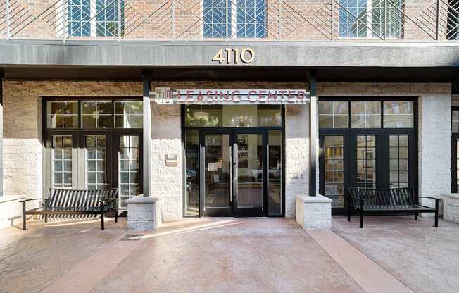 the front of a building with two doors and a sign that reads 410