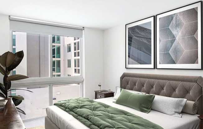 Bedroom with a bed and a large window  at Douglas Enclave located in Miami, FL.