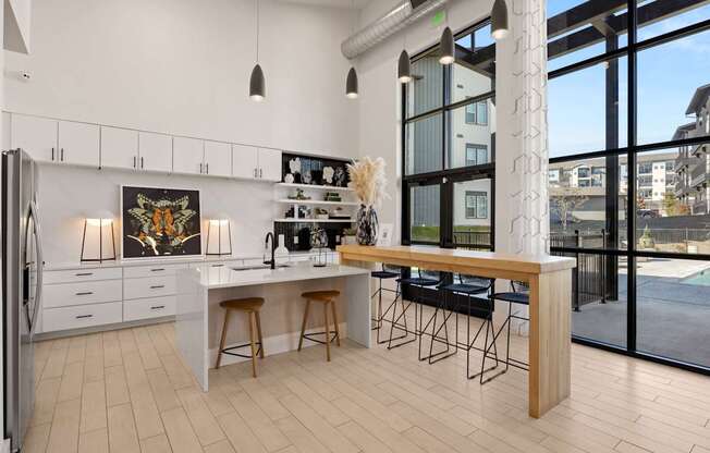 A kitchen with a white countertop and a fridge. at Bridge at Tech Crossing, Austin, 78753