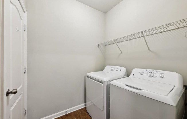 A laundry room with a  washer and dryer machines.