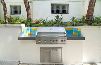 a stainless steel barbecue grill in a backyard