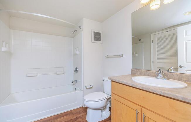 a room with a sink and a mirror