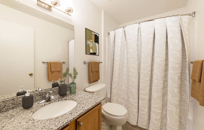 Virtually Staged Bathroom at Pinewood Apartments, Houston, TX