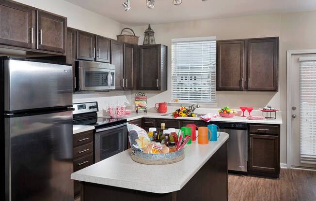 Kitchen with Island and Stainless Steel Appliances