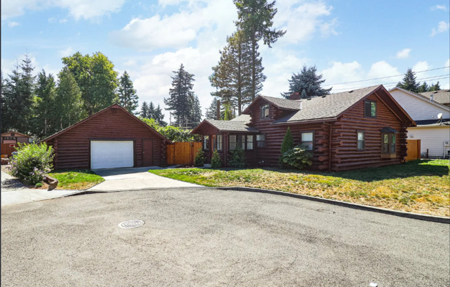 Amazing Log Cabin on a Large Corner Lot with Oversized 2 Car Garage!