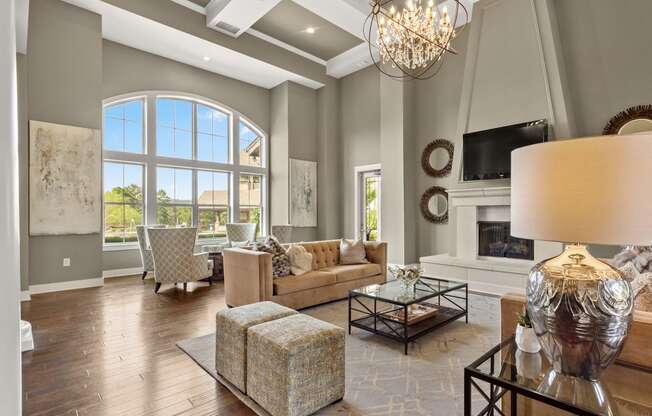 the living room has a fireplace and a large window