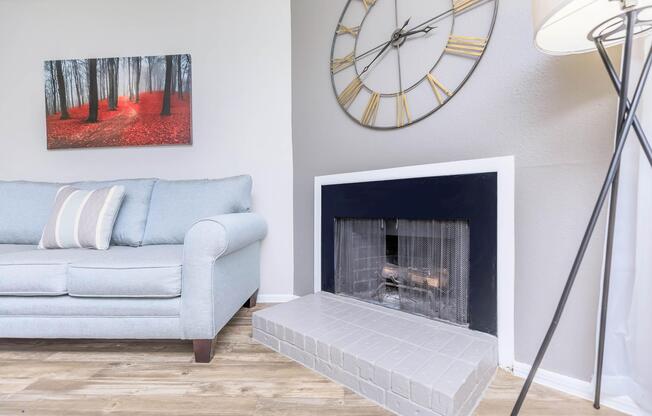 a living room filled with furniture and a fireplace