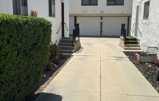 Upstairs 1 bedroom 1 bath unit with a one car garage included.