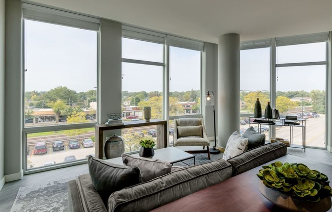 3 BR Apartments in Mount Prospect IL - 20 West - Living Room with Wood-Style Flooring and Floor-to-Ceiling Windows