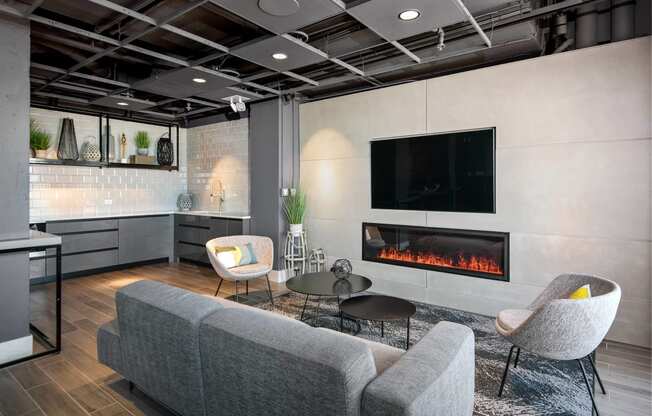 a living room with a fireplace and a tv