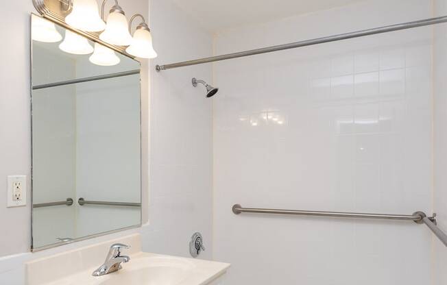 Quincy commons one bedroom bathroom with bright white clean finishes
