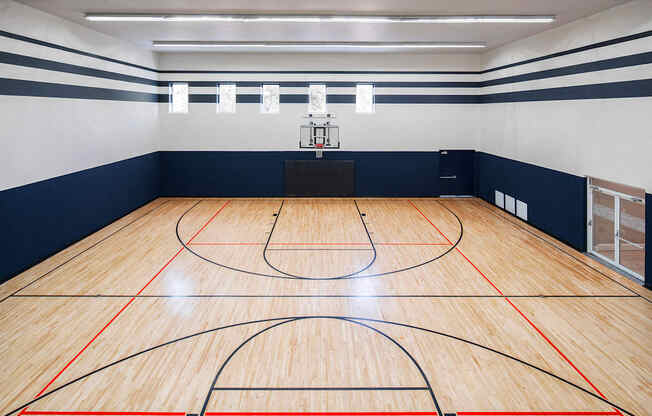 a basketball court in a gym at a school