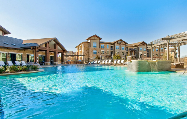 Resort-style pool surrounded by luxury apartments in Grapevine TX.