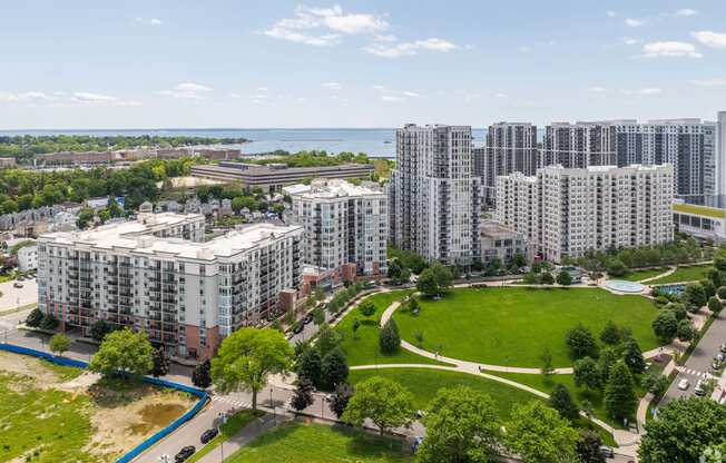 an aerial view of a city with tall buildings and a park