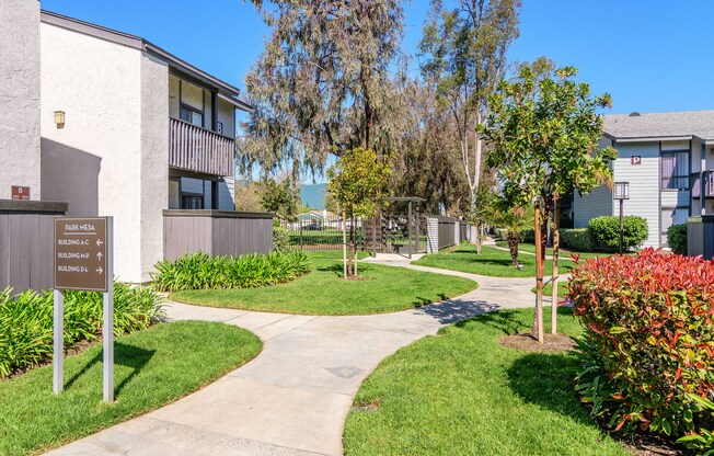 A signpost in front of a building with the words 