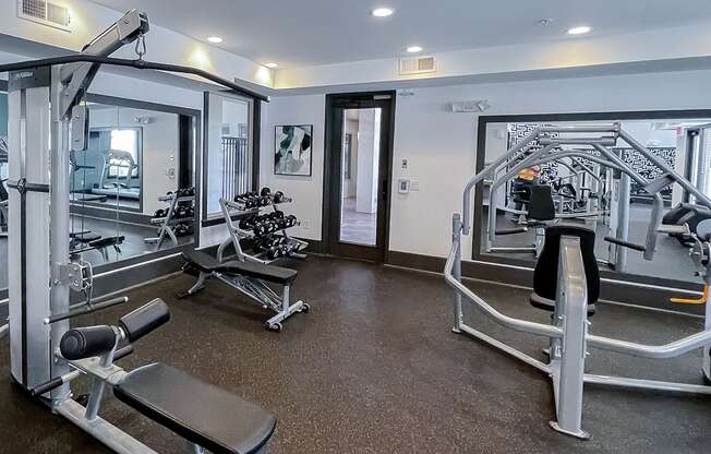 Strength equipment in the fitness center   at Two Addison Place Apartments , Pooler, 31322