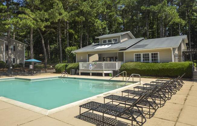 Daytime view pool with patio and sundeck1 at Harvard Place Apartment Homes by ICER, Lithonia, Georgia