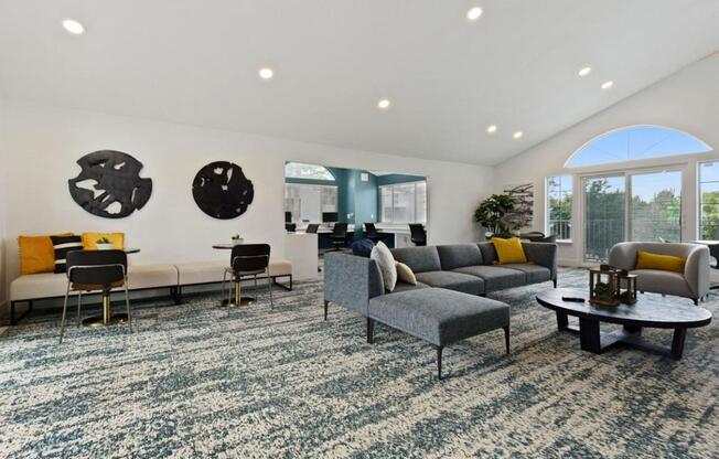 A living room with a grey sofa and a coffee table.