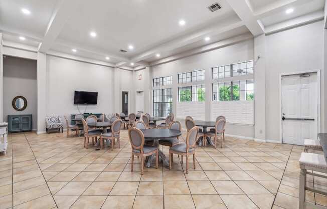 the dining room has a large table and chairs and a tv at St. Augustine Estate, Texas