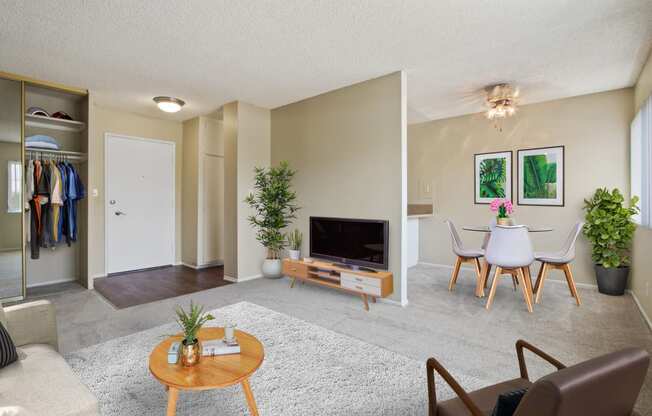 Living room and dining area with carpeted floors throughout