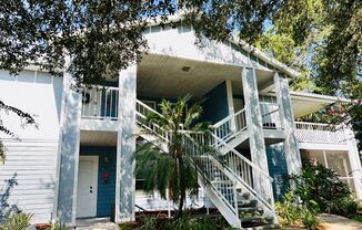 MOVE IN NOW!! NEW LAMINATE PLANK FLOORING & FRESH PAINT! Spacious 2nd floor- 2bd 2ba condo in gated community!! LARGE SCREENED IN BALCONY!