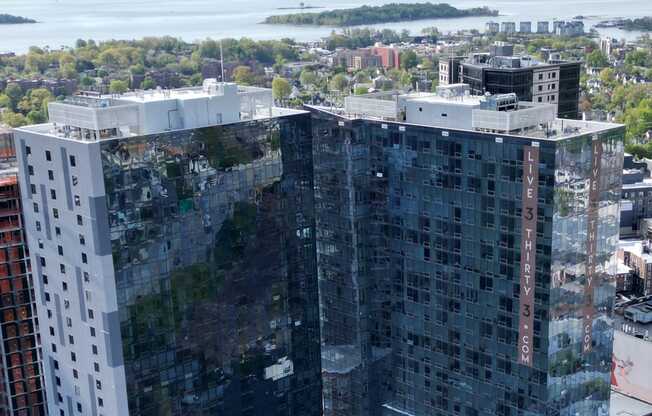 an aerial view of a tall building in the city