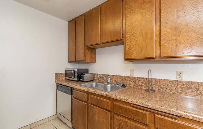 a kitchen with a sink and a microwave