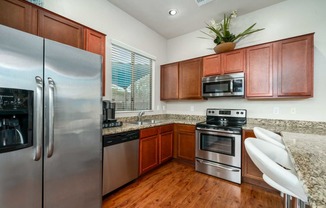 Kitchen with Stainless Steel Appliances at Avilla Preserve Apartment Homes in Tucson Arizona