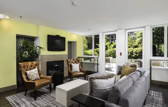 Clubhouse with lounge seating, wall tv and fireplace at Axis, Washington, 98109
