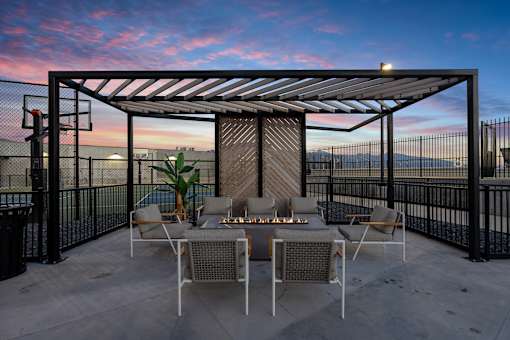a patio with a table and chairs under a pergola at SevenO2 Main Apartments, Salt Lake City, Utah