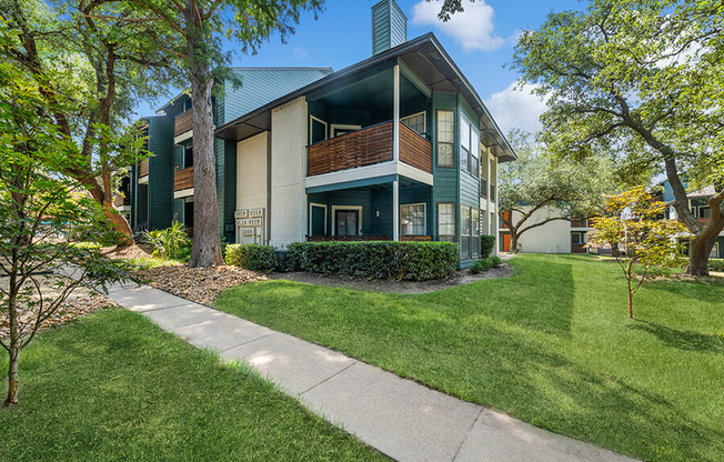 Exterior Community Building and Landscape at Bridges at Deer Run Apartments in Dallas, TX.