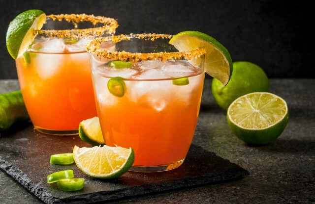 Red Colored Cocktails with Lime and Jalapenos