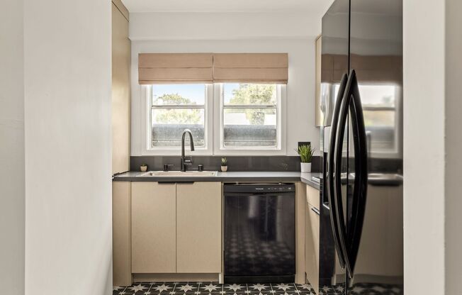 A 4 Bedroom, 3 Bathroom apartment with common areas and a fully functional kitchen at 1476 Malcolm Ave.