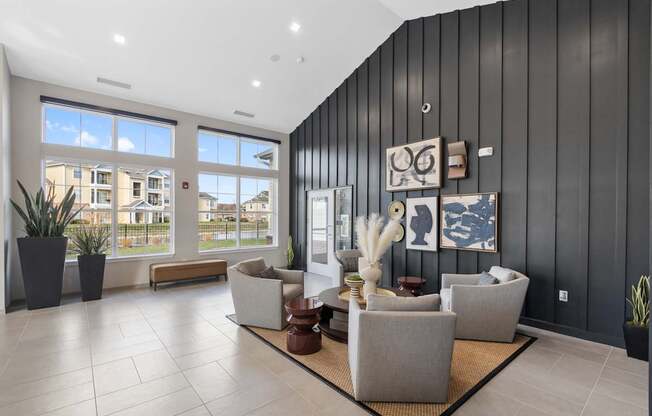 A modern living room with a large window and a view of a residential area.