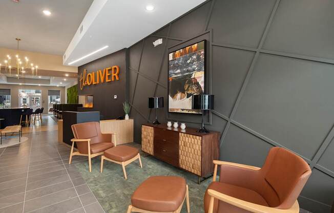 A room with chairs and a sign that says "Koliver".