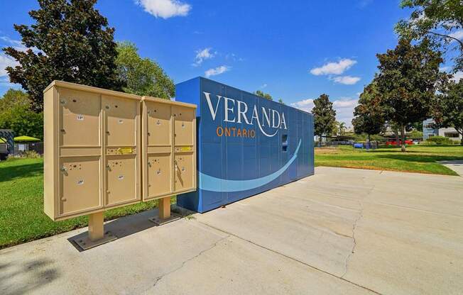 a sign forvera on a sidewalk with lockers