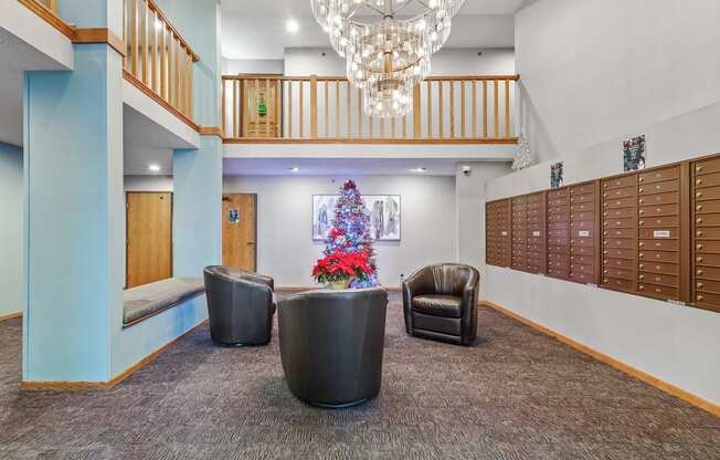 a christmas tree in the lobby of a building with lockers