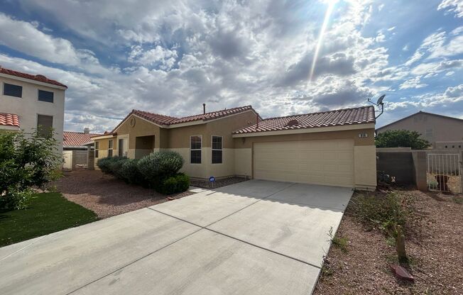 Single story home with open floor plan and tile flooring.