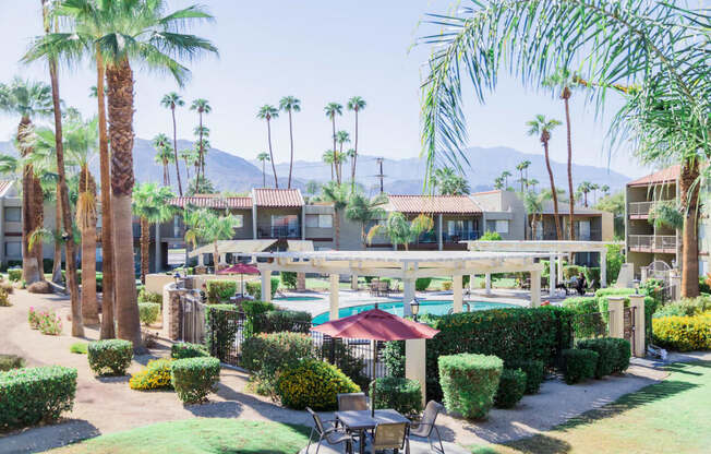 a resort with a pool and palm trees