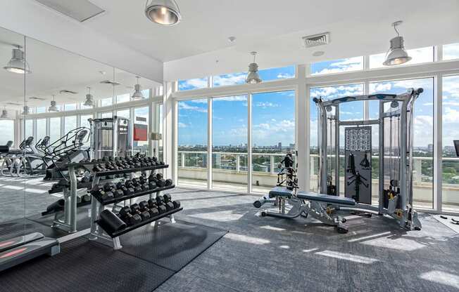 A gym with a view of the city.
