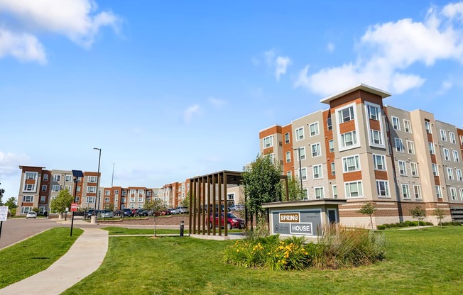 a city street with an apartment building and a sidewalk