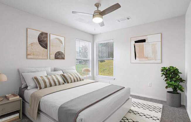 Pet-Friendly Rentals in Little Rock, AR – Capitol Hill – A bedroom with a large bed and a ceiling fan.