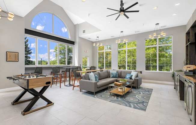 a living room with a couch and a pool table