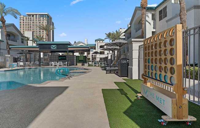 A pool area with a sign that says "The Met" on it.