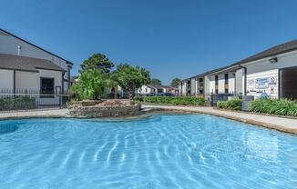 a house with a large pool of water